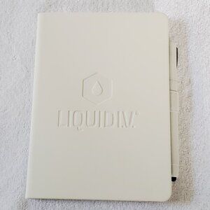 Blank lined White Journal embossed with Liquid IV logo, and pen